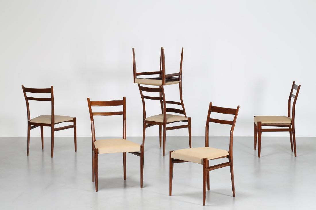 GIULIO MOSCATELLI Six walnut and fabric chairs by (1 of 4)