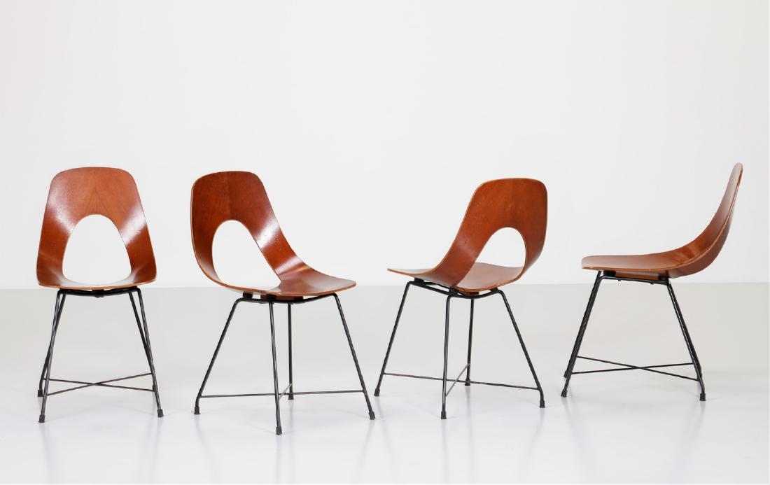AUGUSTO BOZZI Four chairs.: Four chairs. Curved plywood and iron. Cm 40,50 x 80,00 x 50,50. Black painted metal structure, curved plywood shell. Ariston model, for Saporiti (Company brand: "Fratelli Saporiti, Besmate, Italia. Pa