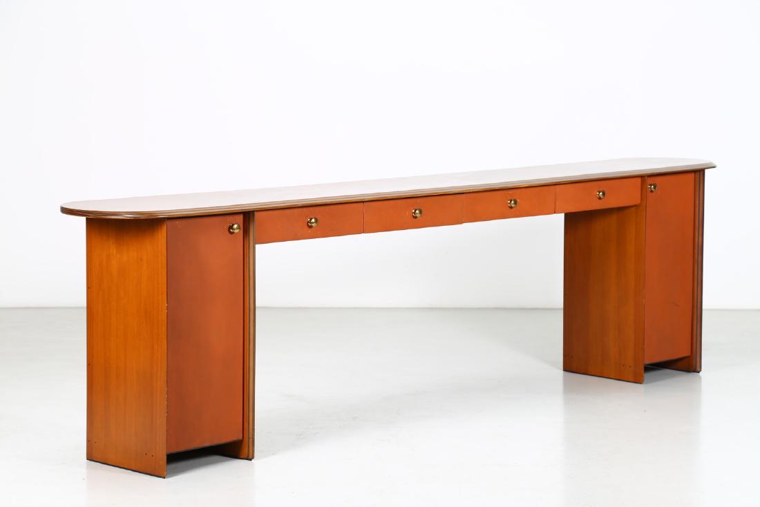 TOBIA SCARPA Console.: Console. Walnut, leather and brass. Cm 303,00 x 83,00 x 43,50. Structure in walnut wood, top in briarwood, lining of drawers and leather doors, handles in brass. For B&B, 70s.