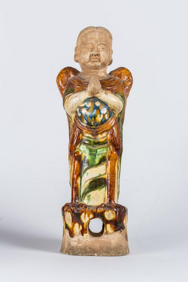 Arte Cinese  A sancai glazed pottery figure of a (1 of 3)