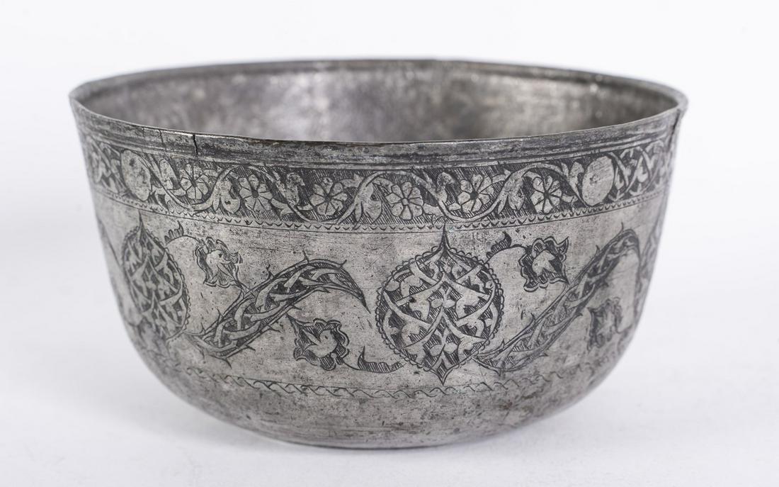 Arte Islamica  A tinned copper bowl engraved with split (1 of 3)