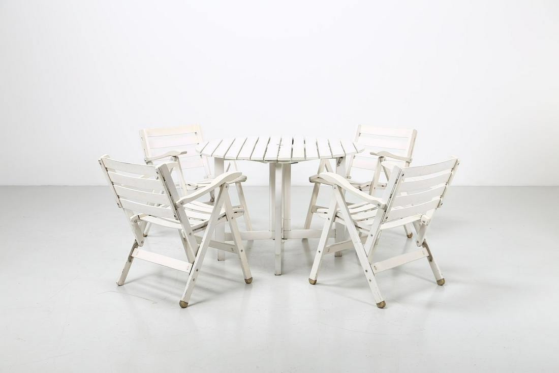 FRATELLI REGUITTI  Table with four folding armchairs, (1 of 2)