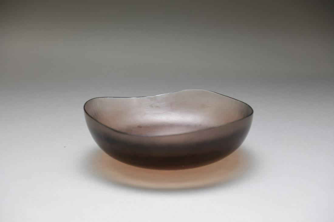 TOBIA SCARPA Amethyst glass bowl model 8502, from: Amethyst glass bowl model 8502, from series Battuti produced by Venini, 1960s. Etched glass. Cm 25,00 x 8,50 x 25,00. Acid signature. Literature: Barovier M., Sonego C., Paolo Venini e la sua fornace,