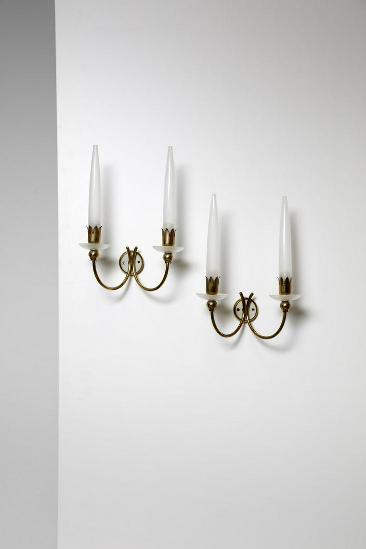 ANGELO LELII Pair of wall lights, about 1960.: Pair of wall lights, about 1960. Opal glass and brass.. Cm 30,00 x 41,00 x 20,00. Literature: Pansera A., Padoan A. , Palmaghini A., ARREDOLUCE catalogo ragionato 1943-1987, Silvana editoriale, Milano