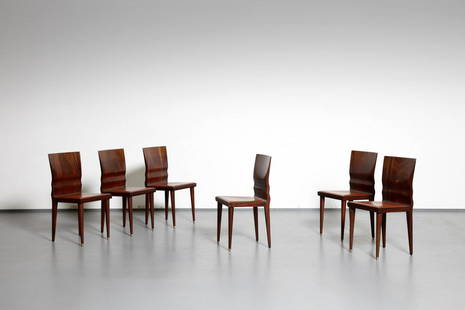 WILLIAM SAWAYA Six Diva chairs, Sawaya&Moroni: Six Diva chairs, Sawaya&Moroni production, 1987. Mahogany and padded skai.. Cm 42,00 x 86,00 x 43,00. Manufacturing brand. Literature: Domus n. 690, January 1988, p. 67