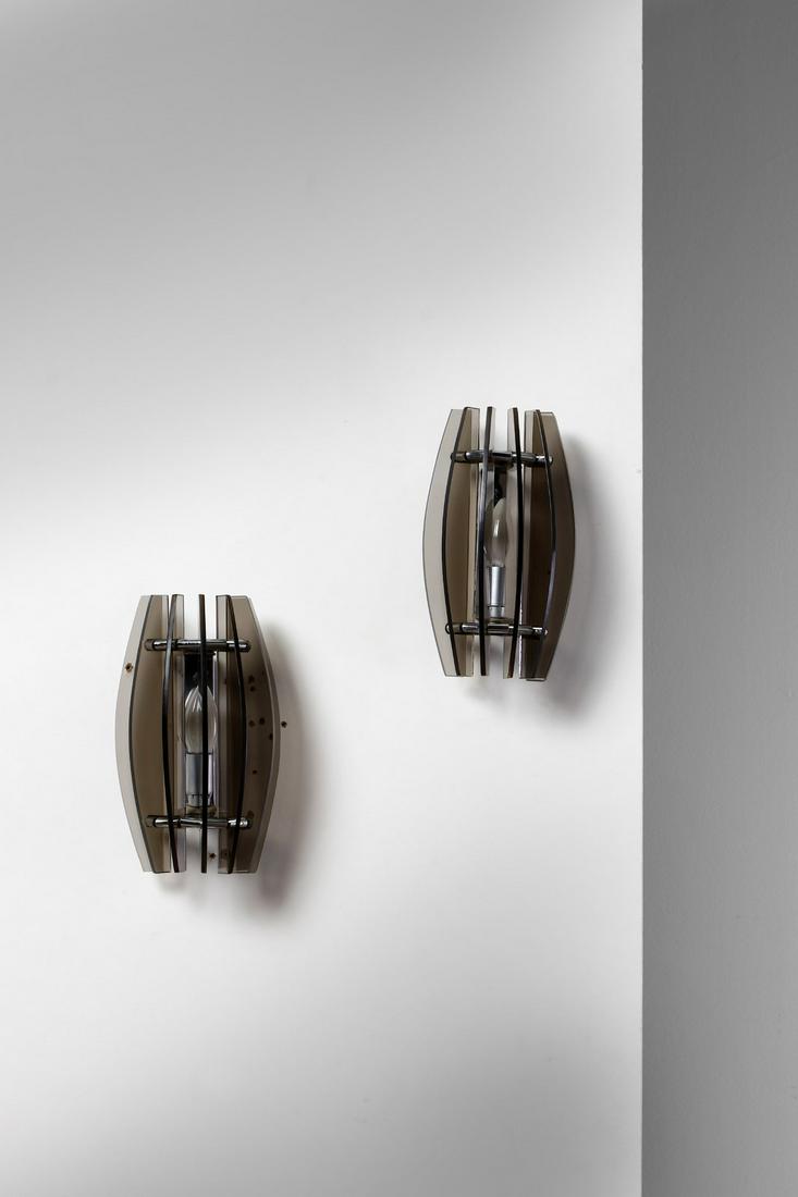 VECA Pair of appliques.: Pair of appliques. Chromed metal and cut crystal.. Cm 17,00 x 28,00 x 12,00.