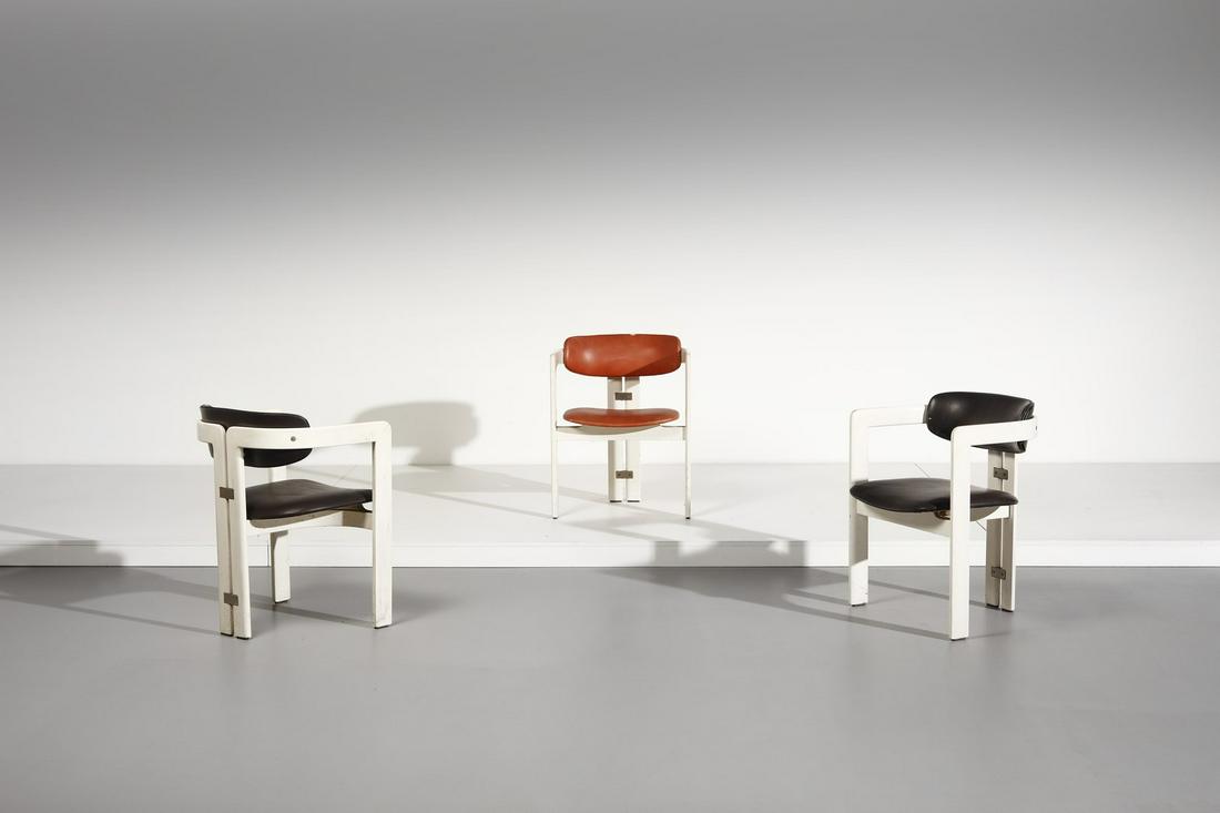 AUGUSTO SAVINI Three Pamplona armchairs, Pozzi: Three Pamplona armchairs, Pozzi production. 1965. Lacquered wood and leather.. Cm 57,00 x 76,00 x 53,00. Literature: Domus n. 483 , February 1970, p. 44