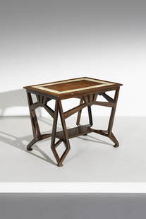 AMEDEO DE VECCHI Low table.: Low table. 1906. Mahogany wood, parchment and pewter.. Cm 84,00 x 70,00 x 60,00.