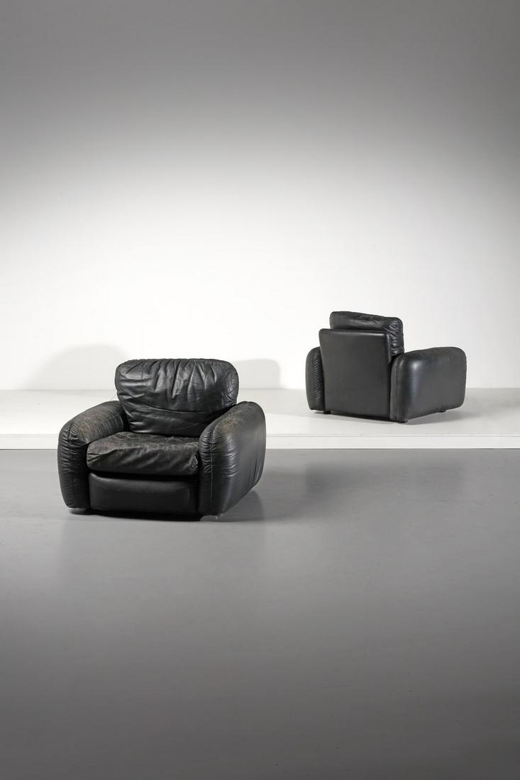 MARCO BOGA Pair of Piumotto armchairs for Mobili Busnelli.: Pair of Piumotto armchairs for Mobili Busnelli. Padded leather.. Cm 90,00 x 65,00 x 90,00. Literature: Domus n. 546, May 1975, p. 45