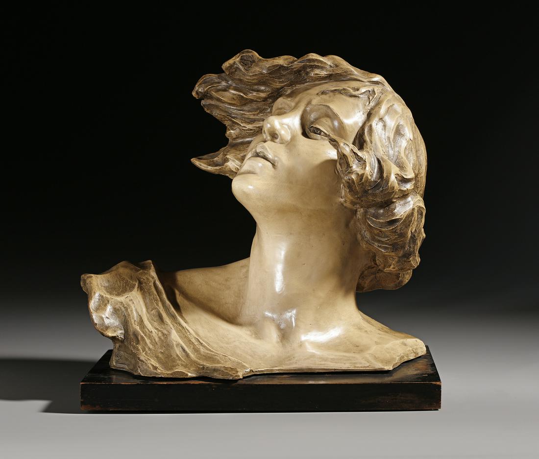 SCULTORE DEL XX SECOLO  A patinated metal female bust, on a wooden base. (1 of 5)