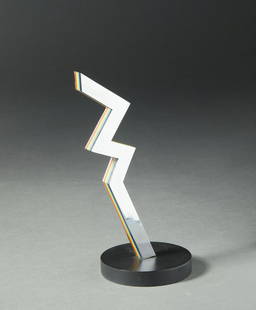 LUCIO DEL PEZZO Zig-zag colore. .: Zig-zag colore. . 1975. Painted aluminum and chromed metal. Cm 10,00 x 25,50 x 2,00. P.d.a. Edition and signtaure in print under the base. Size with the base: 27.5x15x12 cm. Small defects.