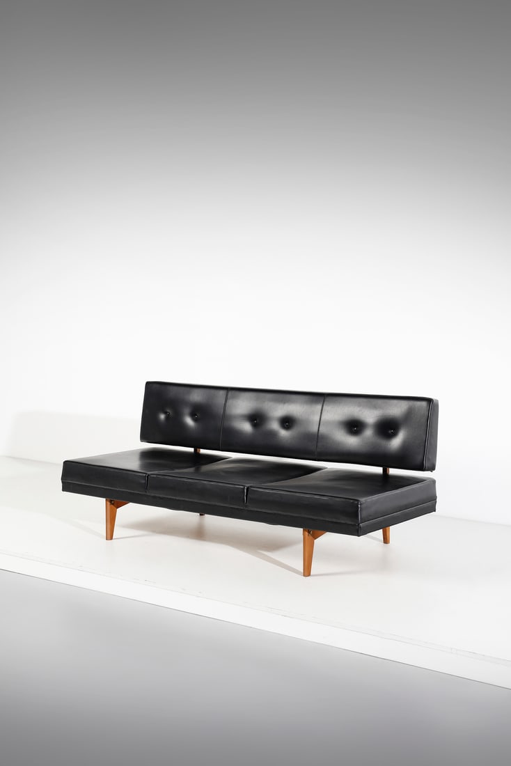 GIANFRANCO FRATTINI in the style of. Sofa.: in the style of. Sofa. Birch wood and padded imitation leather.. Cm 185,00 x 77,00 x 82,00. 1960s.