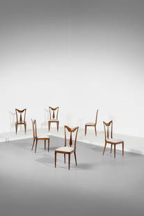 EUGENIO QUARTI in the style of. Six chairs.: in the style of. Six chairs. Walnut and padded fabric.. Cm 43,00 x 98,00 x 43,00. 1950s.