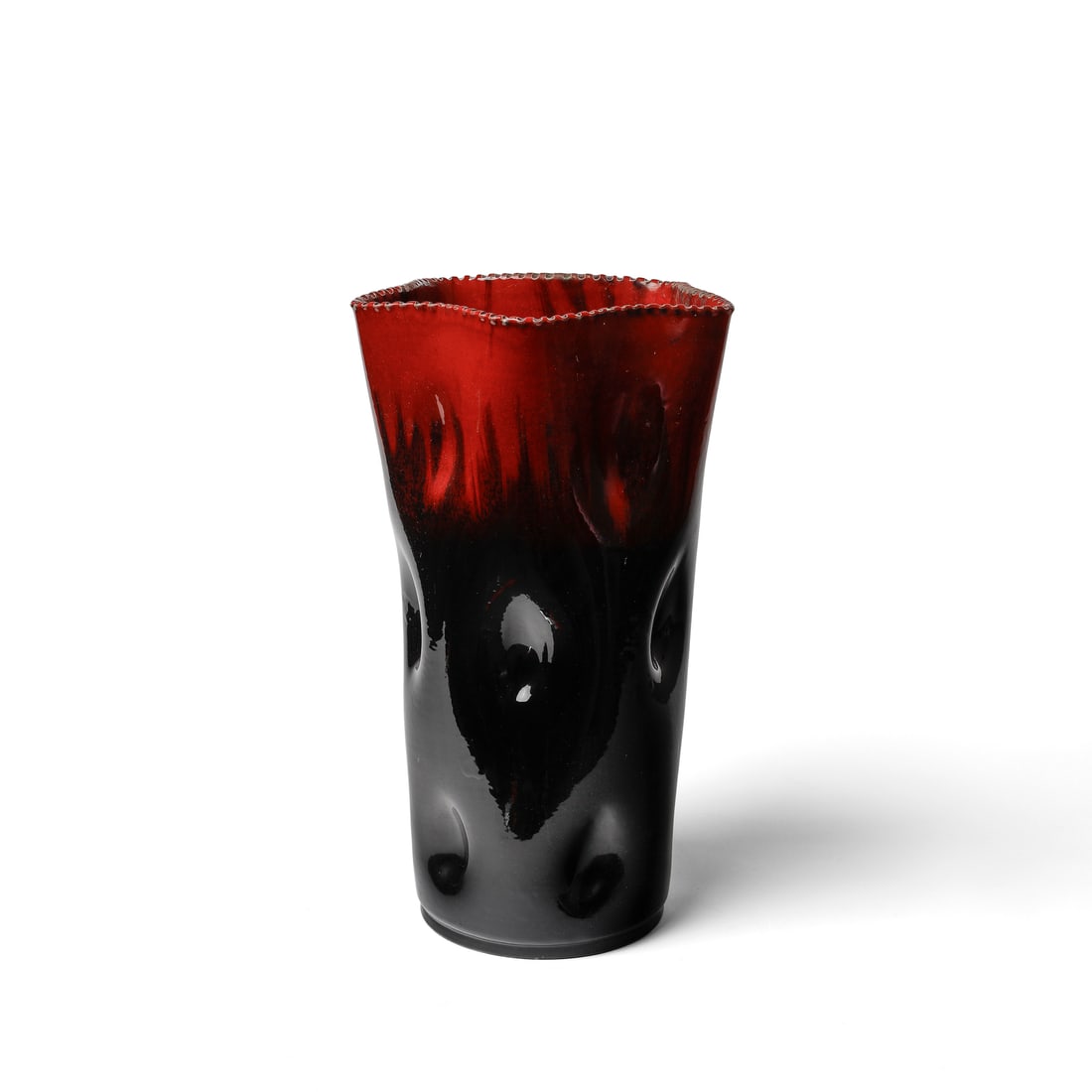 AMBROGIO POZZI Vase with irregular edge and surface decorated with inflections for Ceramica Pozzi,: POZZI AMBROGIO (1931 - 2012) Vase with irregular edge and surface decorated with inflections for Ceramica Pozzi, Varese. Underglazed ceramic in shades of red and black.. Cm 27,00 x 46,00 x 27,00. 1950