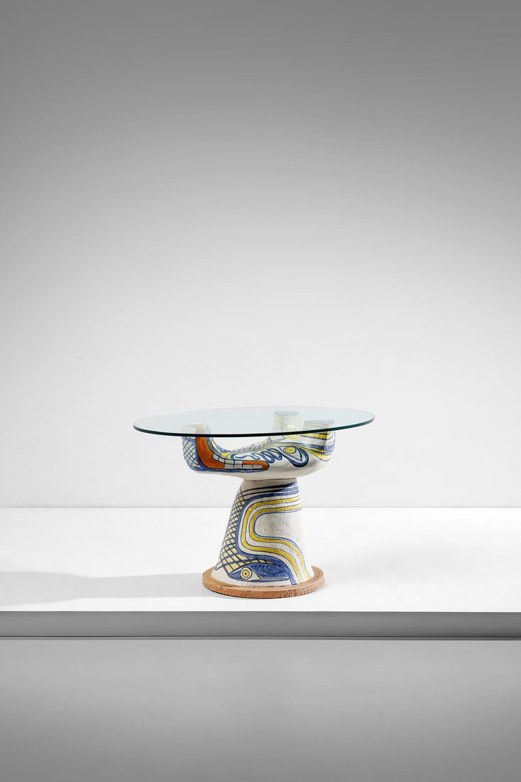 SALVATORE MELI Living room table with sculptural base featuring a zoomorphic subject, Rome.: MELI SALVATORE (1929 - 2011) Living room table with sculptural base featuring a zoomorphic subject, Rome. Glass and white glazed ceramic hand-painted in yellow, blue and orange.. Cm 110,00 x 72,00 x 7