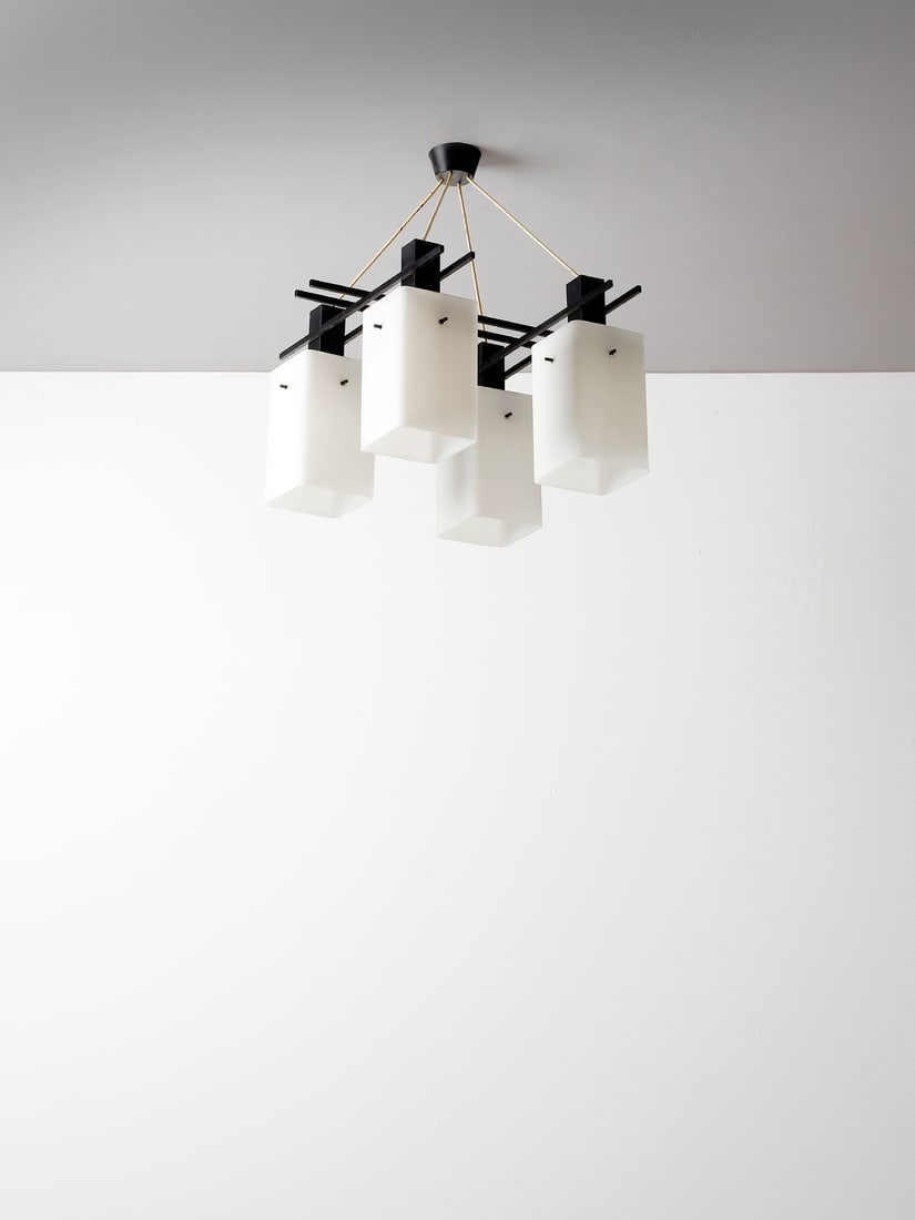 STILUX Four-lights suspension lamp, Milan.: STILUX Four-lights suspension lamp, Milan. Brass, painted metal and satin incamiciato lattimo glass.. . 1950s.