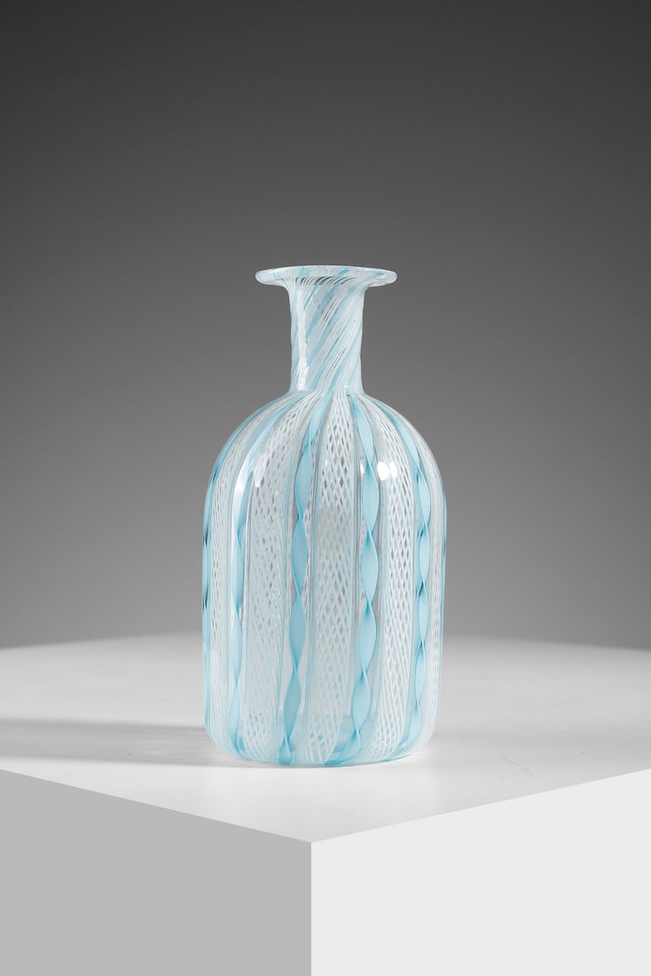 MANIFATTURA MURANESE Bottle.: MURANO WORK Bottle. Colorless transparent glass with lattimo zanfirico canes and twisted turquoise canes.. Cm 6,00 x 15,00 x 6,00. 1940s.