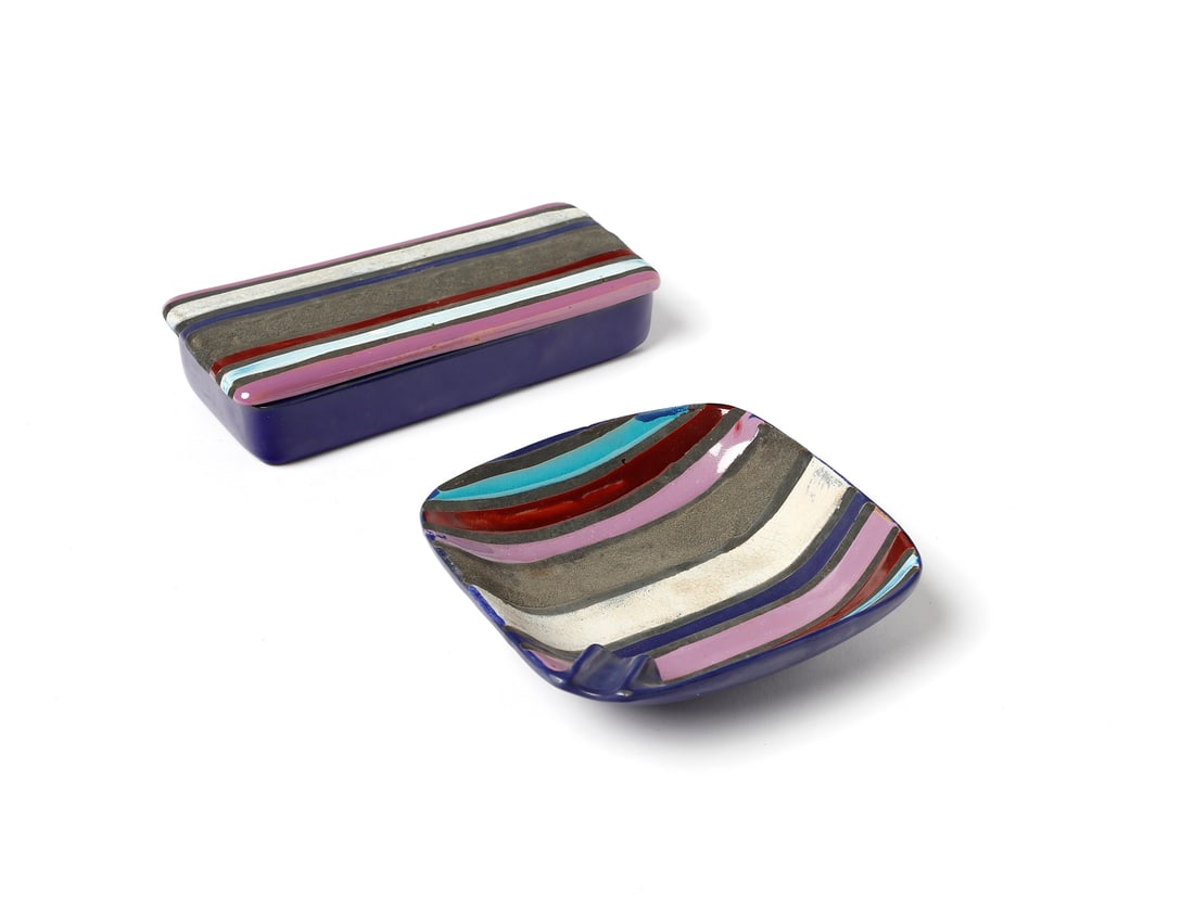CERAMICHE RAYMOR Box and ashtray.: CERAMICHE RAYMOR Box and ashtray. Polychrome glazed ceramic.. . Second half of the XXth century.Paper label under the base and numeral.Dimensions: box 4.5 x 20.5 x 9 cm; ashtray 4 x 16 x 16 cm