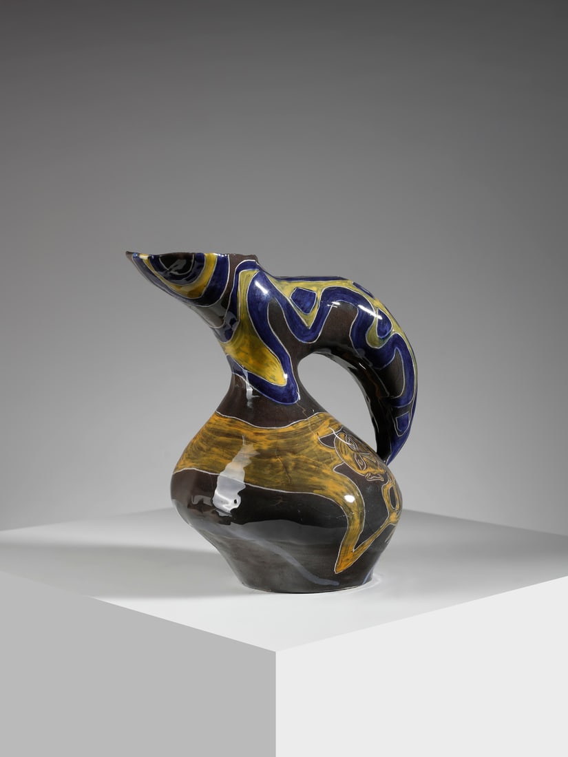 SALVATORE MELI Jug decorated with abstract motifs and human figure, Rome.: MELI SALVATORE (1929 - 2011) Jug decorated with abstract motifs and human figure, Rome. 1953. Grey/brown glazed terracotta with yellow, white and blue decorations.. Cm 21,00 x 21,50 x 15,50. Signed, d
