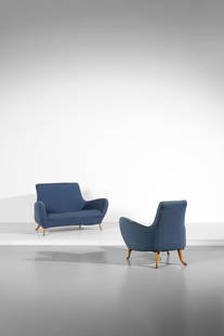 PROSPERO RASULO She armchair and sofa for Poltronova, Florence.: RASULO PROSPERO (n. 1953) She armchair and sofa for Poltronova, Florence. 1992. Wood and padded fabric.. . Production label. Dimensions: sofa 88 x 130 x 80 cm; armchair 88 x 88 x 83 cm
