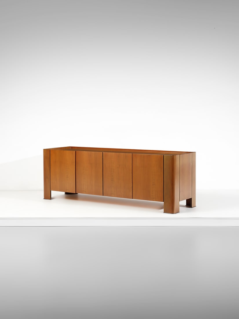 MARCO ZANUSO Four doors Eton sideboard for Arflex, Milan.: ZANUSO MARCO (1916 - 2001) Four doors Eton sideboard for Arflex, Milan. 1972. Walnut.. Cm 200,00 x 68,00 x 61,00. Literature (model with legs resting on the ground): G. Gramigna, Repertorio del design