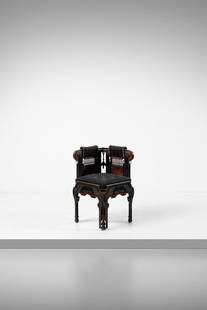 EUGENIO QUARTI Neo-Orientalist corner armchair.: QUARTI EUGENIO (1867 - 1929) Neo-Orientalist corner armchair. 1899. Wood, ebonized wood, mother-of-pearl, metal and embroidered fabric.. Cm 42,50 x 79,00 x 42,50. From the collection of Avv. Cav. Giov