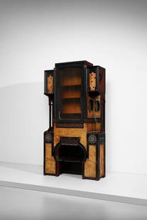 EUGENIO QUARTI Neo-Orientalist double-body cupboard with four side cabinets, central part with open: QUARTI EUGENIO (1867 - 1929) Neo-Orientalist double-body cupboard with four side cabinets, central part with open compartments, drop-down compartment concealing a writing desk and display cabinet. 189