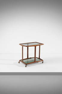 ANGELO OSTUNI Trolley.: OSTUNI ANGELO (1904 - 1981) Trolley. 1950. Walnut wood, smoked glass and metal.. Cm 71,00 x 66,50 x 46,50. Literature: R. Aloi, Esempi di arredamento moderno. Tavoli, tavolini, carrelli, Hoepli, 1950,