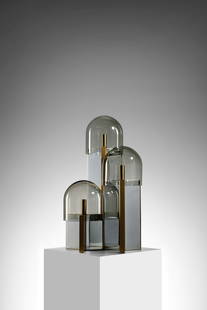 GAETANO SCIOLARI Table lamp.: SCIOLARI GAETANO (1927 - 1994) Table lamp. Mirrored metal, brass-plated metal and smoked glass.. Cm 45,00 x 65,00 x 45,00. 1970s.Paper label under the base.