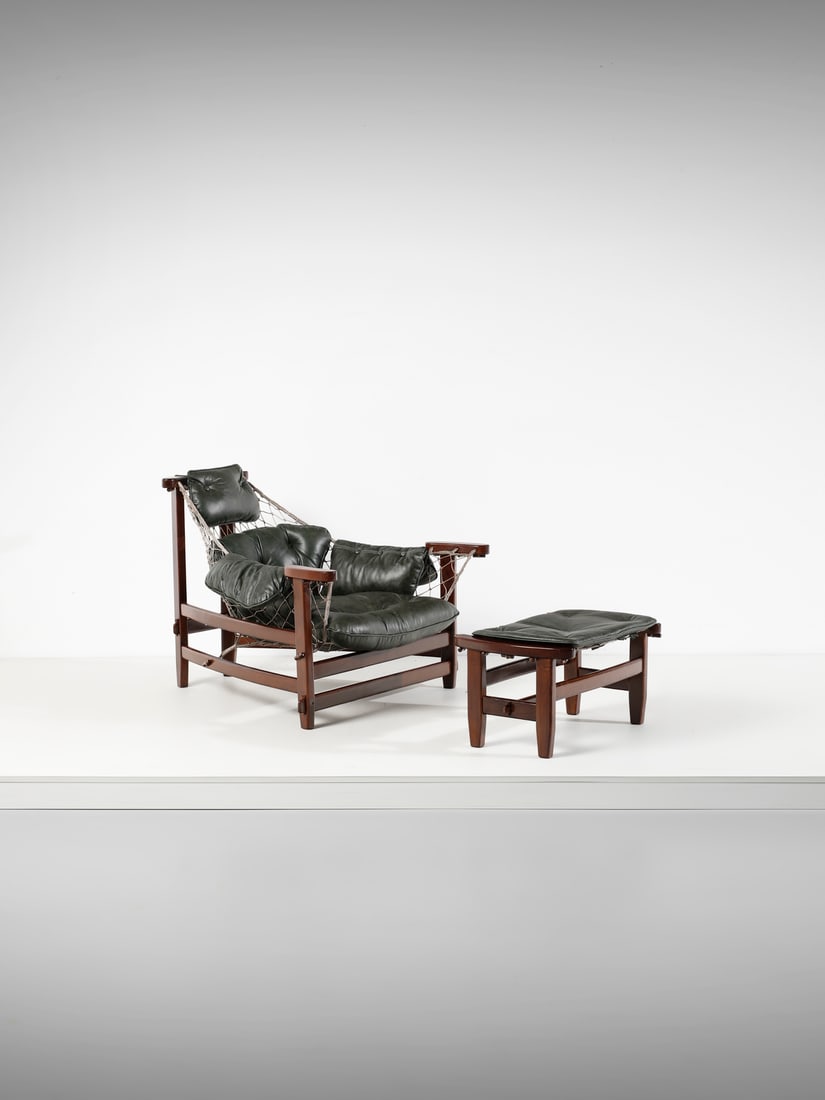 JEAN GILLON Jangada Lounge chair armchair with footrest for Italma, Brazil.: GILLON JEAN (1919 - 2007) Jangada Lounge chair armchair with footrest for Italma, Brazil. Wood, rope and padded leather.. . 1960s.Dimensions: armchair 88,5 x 95 x 105,5 cm; footrest 35 x 67 x 44 cmLit
