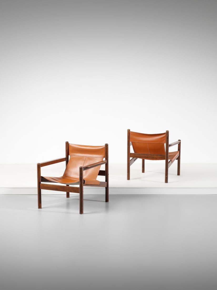 MICHEL ARNOULT Pair of Roxinho armchairs, Argentina.: ARNOULT MICHEL (1922 - 2005) Pair of Roxinho armchairs, Argentina. Wood and leather.. Cm 67,00 x 75,00 x 61,00. 1960s.