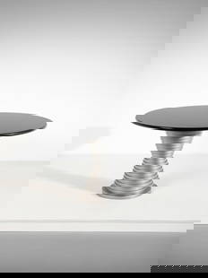 MANIFATTURA ITALIANA Table with circular top and hourglass base with concentric rings.: ITALIAN WORK Table with circular top and hourglass base with concentric rings. Painted wood and marble.. Cm 120,00 x 74,00 x 120,00. 1980s.