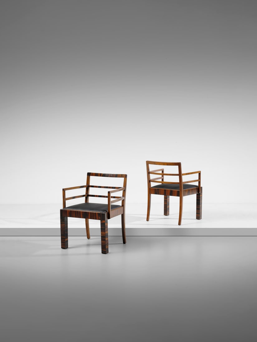 BRUNO PAUL attributed. Pair of rationalist chairs with armrest.: PAUL BRUNO (1874 - 1968) attributed. Pair of rationalist chairs with armrest. Wood and padded leatherette.. Cm 61,00 x 822,00 x 60,00. 1930s.