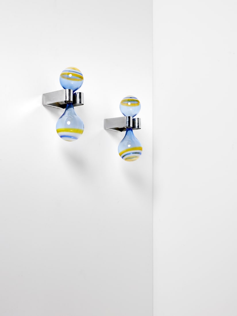 GRUPPO DAM Pair of L/86 Bigoccia wall lamps for La Murrina, Murano.: GRUPPO DAM Pair of L/86 Bigoccia wall lamps for La Murrina, Murano. Clear blue glass decorated with yellow, lattimo and blue murrine; chromed metal frame.. Cm 14,00 x 40,00 x 20,00. 1968-1975.Literatu