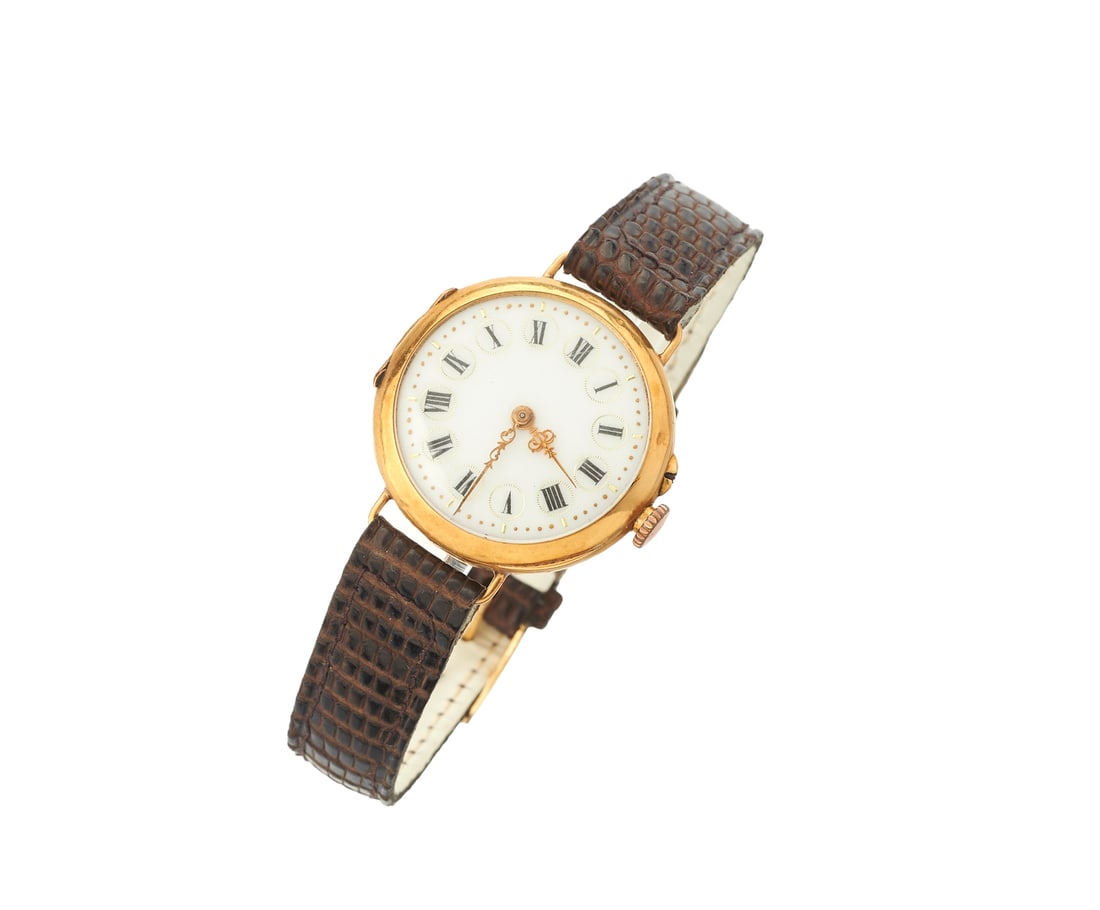 18k gold watch with leather strap. (1 of 3)