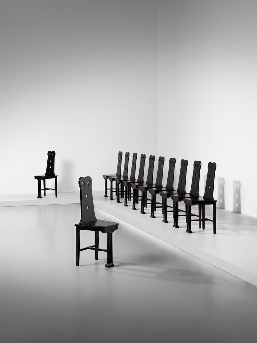 MANIFATTURA ITALIANA Twelve chairs in neo-medieval Liberty style. (1 of 4)