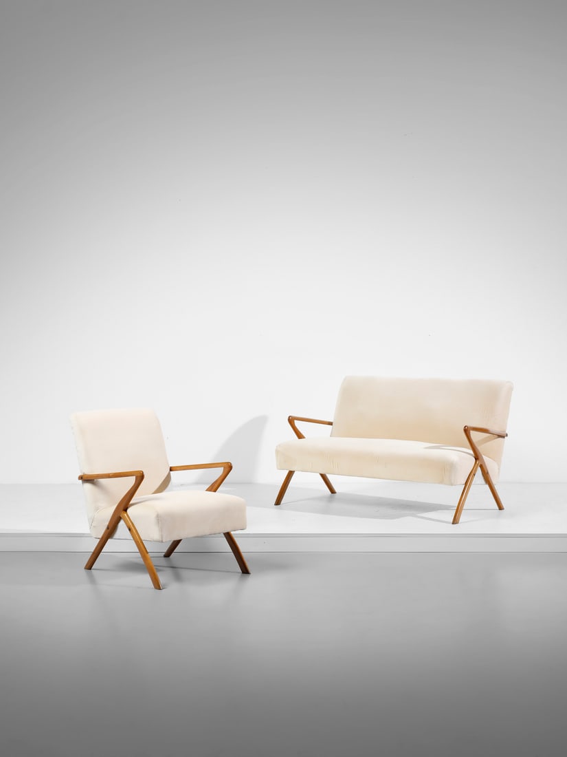 MANIFATTURA ITALIANA Sofa and armchair.: MANIFATTURA ITALIANA Sofa and armchair. Wood and padded microfibre.. . 1950s.Dimensions: sofa 77 x 128 x 80 cm; armchair 77 x 62 x 80 cm