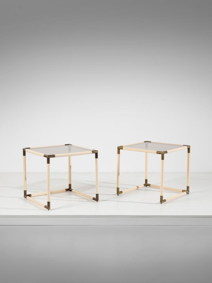BANCI Pair of coffee tables.: BANCI Pair of coffee tables. Brass, plastic and smoked glass.. Cm 60,00 x 56,00 x 60,00. 1970s.
