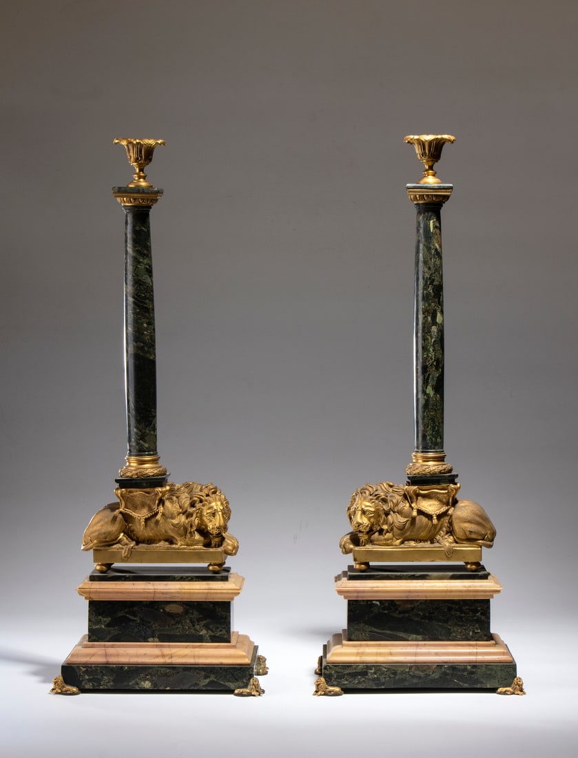 SOPHISTICATED PAIR OF NEOCLASSICAL CANDLESTICKS IN GILDED BRONZE AND GREEN MARBLE.France, 19th: SOPHISTICATED PAIR OF NEOCLASSICAL CANDLESTICKS IN GILDED BRONZE AND GREEN MARBLE.France, 19th century. . Cm 60,00. The expertly sculpted lions are in gilded bronze. The rest of the structure is made