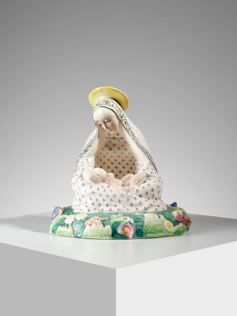 SANDRO VACCHETTI Madonna of the LiliesAll-round sculpture, Lenci manufacture, Turin.: VACCHETTI SANDRO (1889 - 1976) Madonna of the LiliesAll-round sculpture, Lenci manufacture, Turin. Polychrome grazed ceramic.. Cm 20,50 x 21,00 x 18,00. 1934-1935.Signature "ESSEVI" along the edge; ma