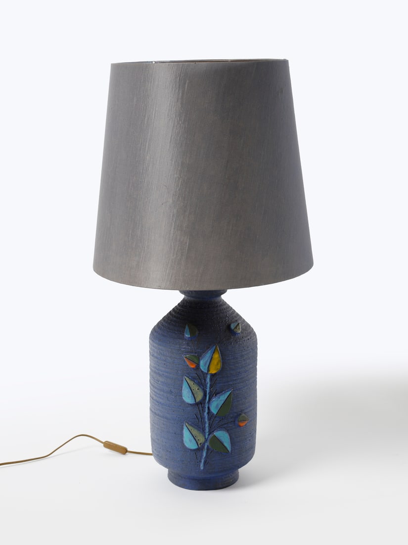 ALDO LONDI Table lamp with base decorated with an engraved floral motif with applied leaves,: LONDI ALDO (1911 - 2003) Table lamp with base decorated with an engraved floral motif with applied leaves, Montelupo Fiorentino. 1961. Blue glazed terracotta with turquoise, yellow, green and orange d