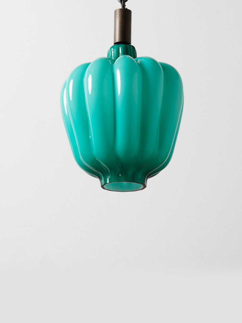 MASSIMO VIGNELLI Chinese lantern pendant lamp for Venini, Murano.: VIGNELLI MASSIMO (n. 1931) Chinese lantern pendant lamp for Venini, Murano. 1954. Green cased glass with large ribs; brass.. Cm 27,00 x 30,00 x 27,00. Dimensions refers to glass only.Literature (for