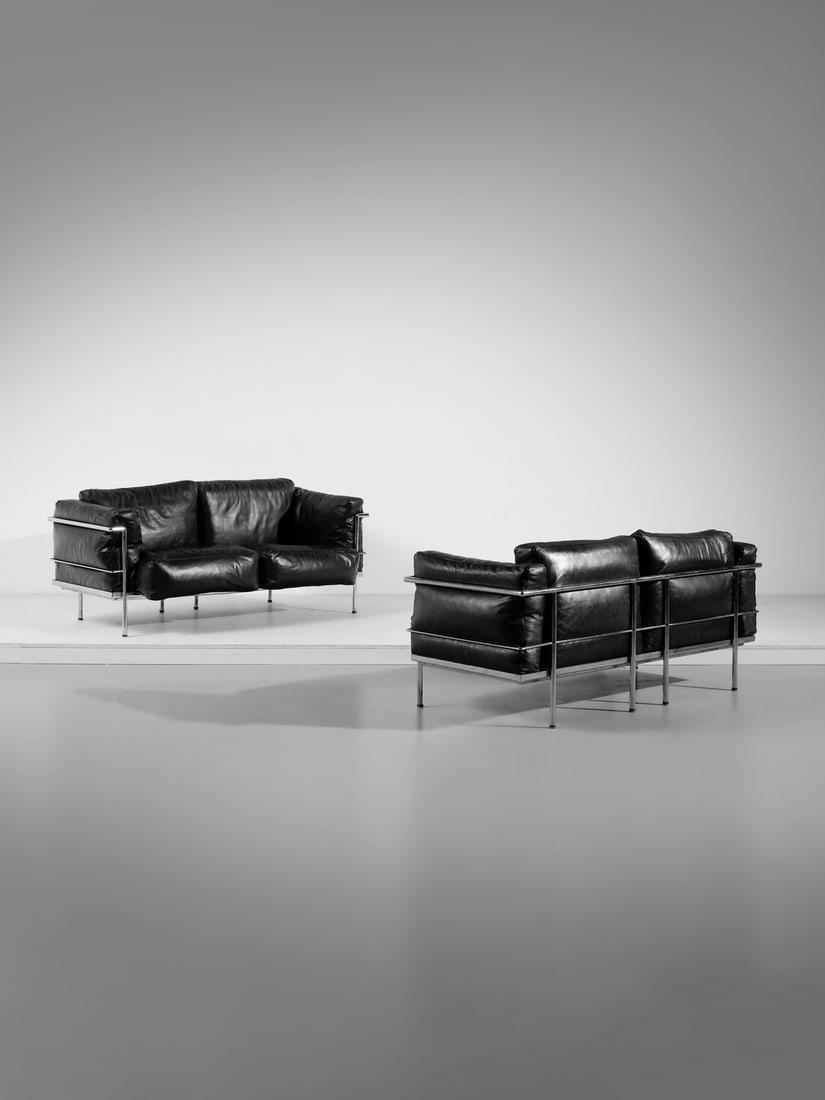 LE CORBUSIER (1887-1965), PIERRE JEANNERET (1896-1967), CHARLOTTE PERRIAND (1903-1999) Pair of LC2: LE CORBUSIER (1887-1965), PIERRE JEANNERET (1896-1967), CHARLOTTE PERRIAND (1903-1999) Pair of LC2 two-seater sofa for Alivar, Florence. Chromed steel and padded leatherette.. Cm 170,00 x 58,50 x 71,0