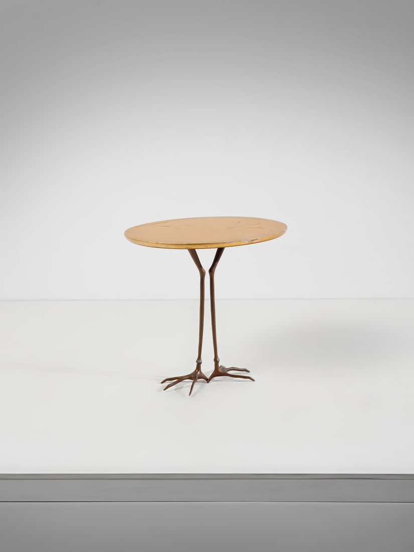 MERET OPPENHEIM Traccia coffee table for Simon, San Lazzaro di Savena.: OPPENHEIM MERET (1913 - 1985) Traccia coffee table for Simon, San Lazzaro di Savena. Cast in bronze and gilded wood.. Cm 68,00 x 65,00 x 53,00. Serial production from the 1970s of the surrealist work