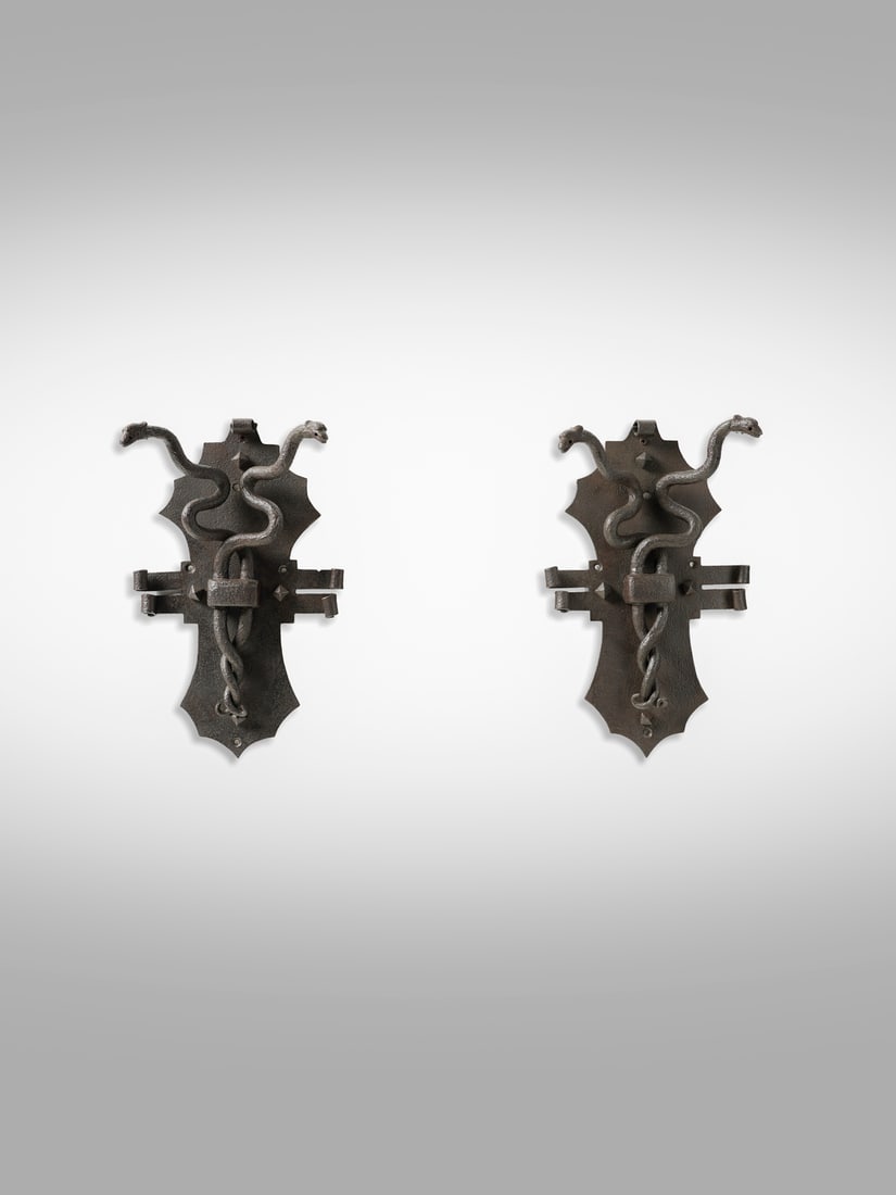 UGO & MODESTO DEMENEGO Pair of knockers decorated with intertwined snakes. (1 of 3)