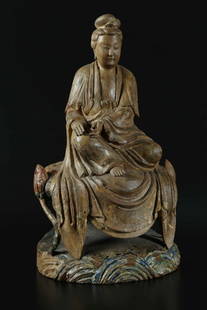 Arte Cinese A wooden Guanyin statue with polychrome: Arte Cinese A wooden Guanyin statue with polychrome traces China, 18th - 19th century . . Cm 30,00 x 55,50 x 25,50.