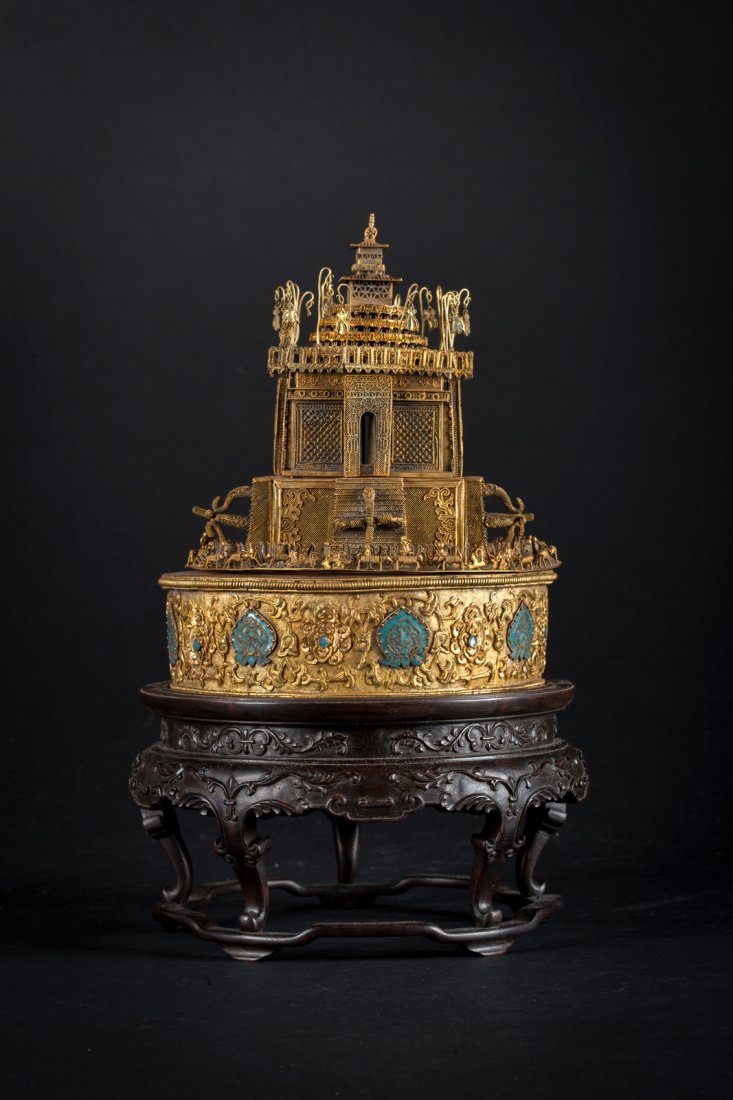 Arte Cinese A gilt silver filigree mandala in the: A gilt silver filigree mandala in the shape of a temple on a Zitan wooden standChina, Qing dynasty. . Cm 32,00. In the structure formed by the complex lacework on four main levels, it is possible to n