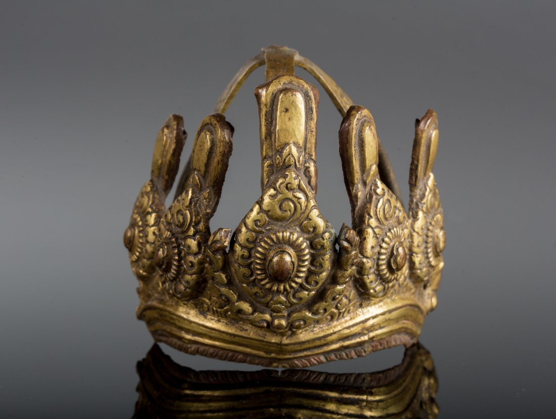 Arte Himalayana An embossed gilt copper ringga Nepal,: An embossed gilt copper ringga Nepal, early 19th century . . Cm 11,00 x 10,00.