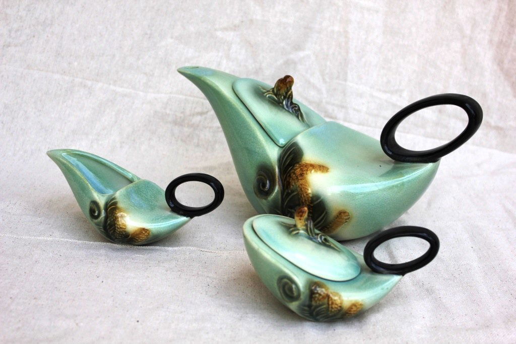 Art Deco Antique Teapot Set: Hull Pottery 1952 Parchment & Pine Tea Set in Turquoise & Black. The large pot is 6" High x 12 1/2" wide x 6" Deep. The small pot with lid measures 3 1/2" High x 6" Wide x 4" Deep. The small pot witho