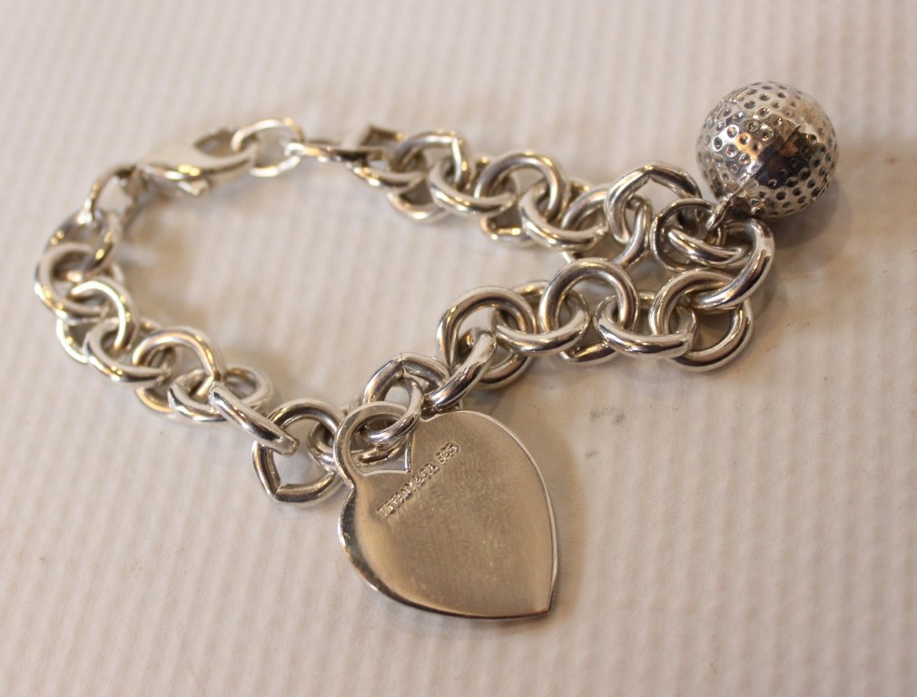 Tiffany & Co. Sterling Silver Bracelet: Tiffany & Co. is a luxury American multinational jewelry and silverware corporation, with headquarters in New York City. Tiffany sells jewelry, sterling silver, china, crystal, stationery, fragrances,
